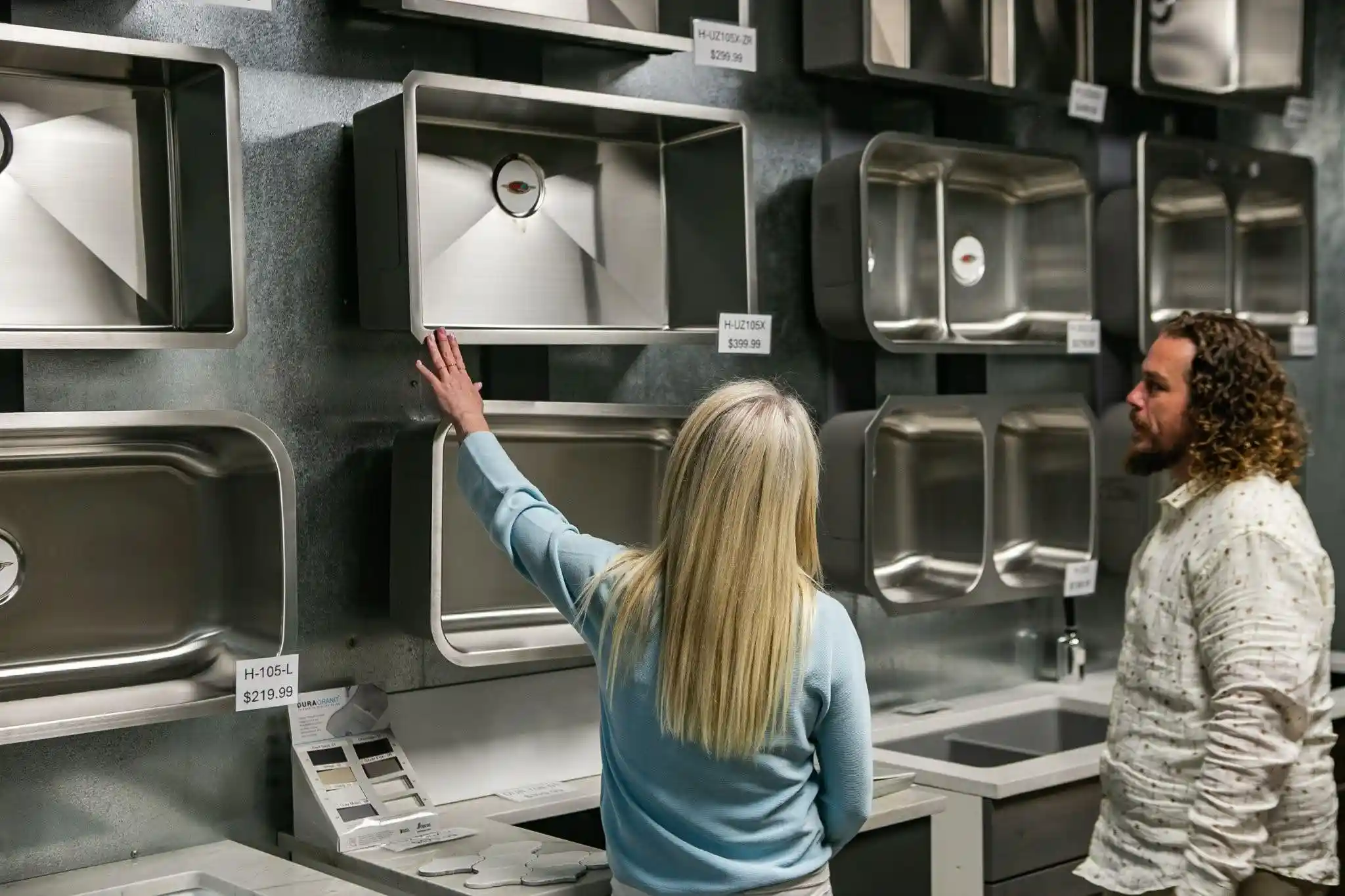 Homeowners choosing a kitchen sink for their countertop project