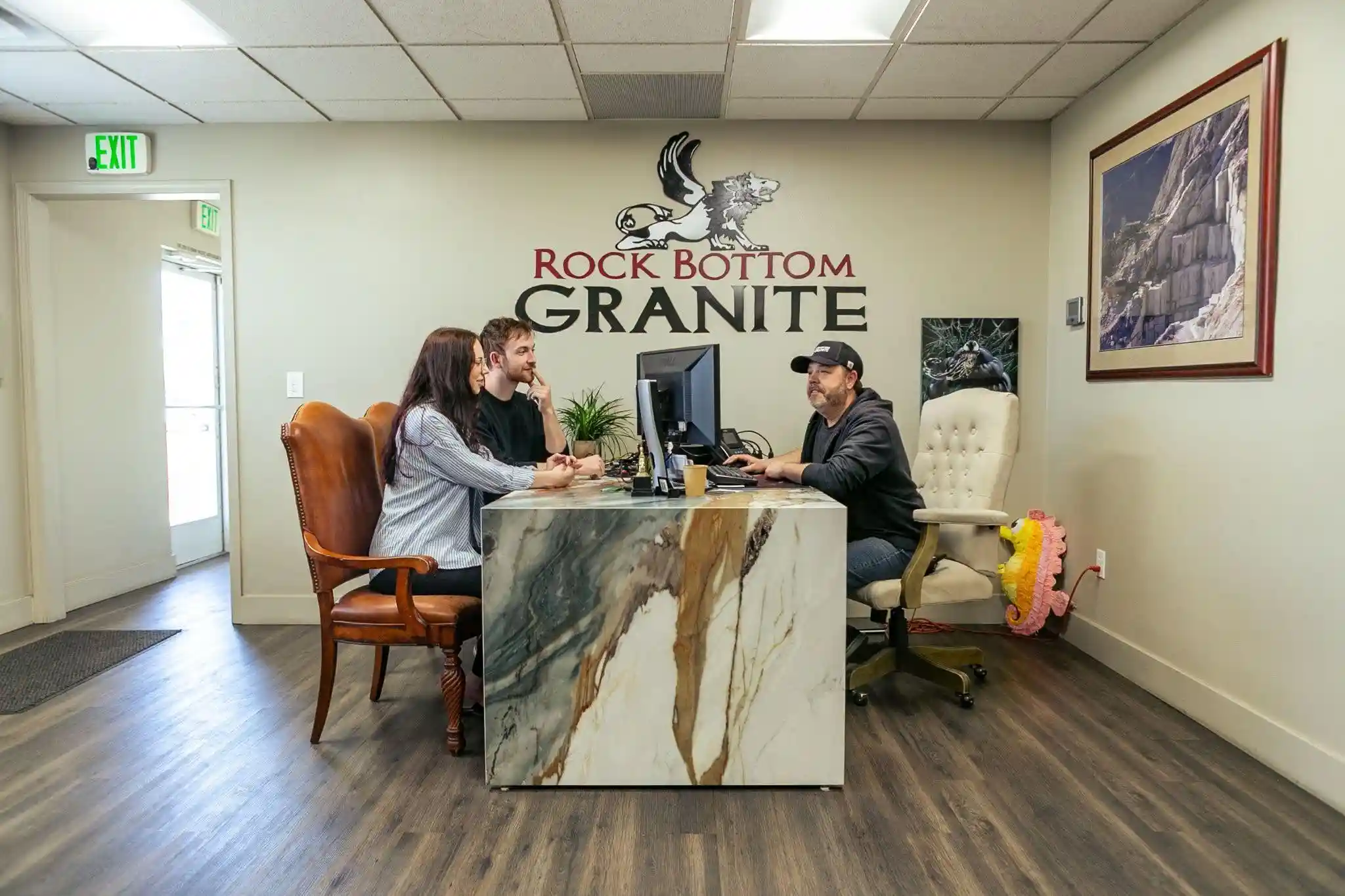 Homeowners discussing natural stone slab layout before fabrication