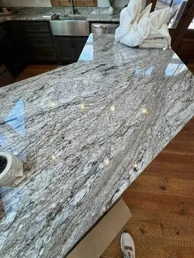 Existing granite countertop with flowing gray and white movement