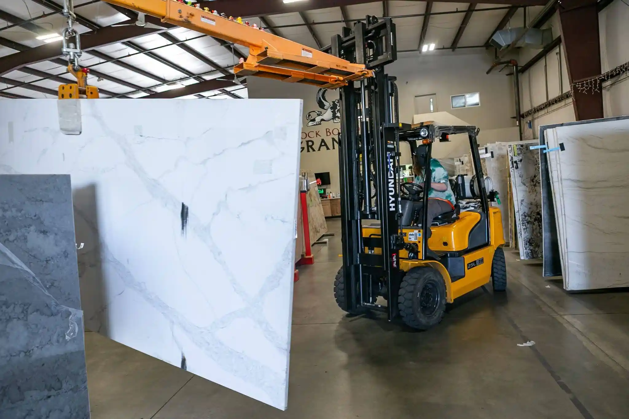 Stone slab being moved inside the RBG Surfaces warehouse