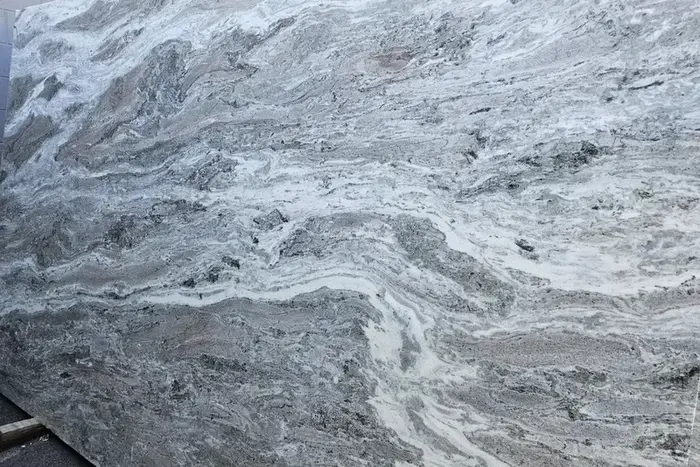 Brown Fantasy dolomite slab with flowing gray and white movement