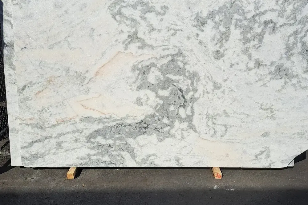 Statuario polished marble slab with pale gray veining
