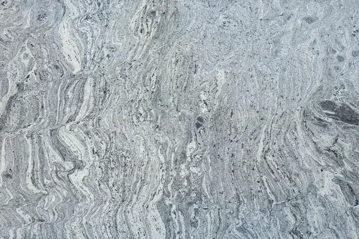Waterfall polished granite with silver and blue flowing movement